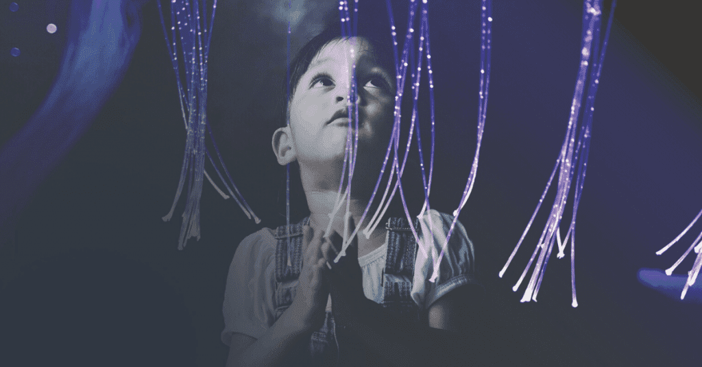 Child looking at fibre optic sensory toy