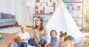 teacher and toddlers in a nursery