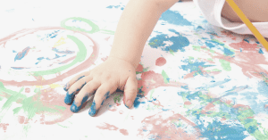 Baby painting with hands