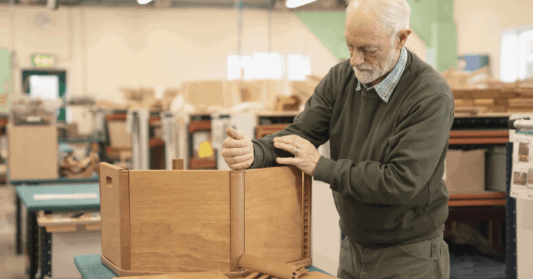 Toy maker making wooden chair