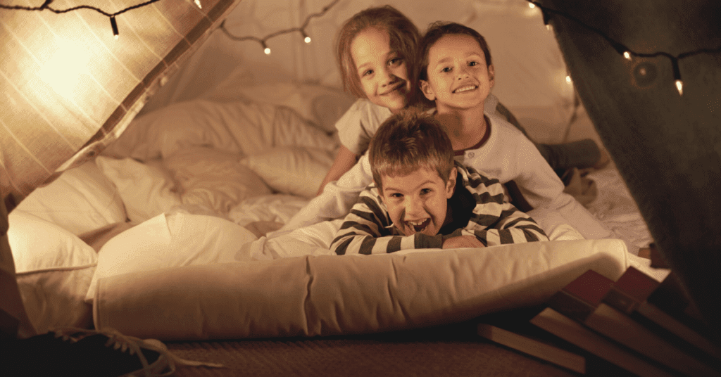 Children in a blanket fort