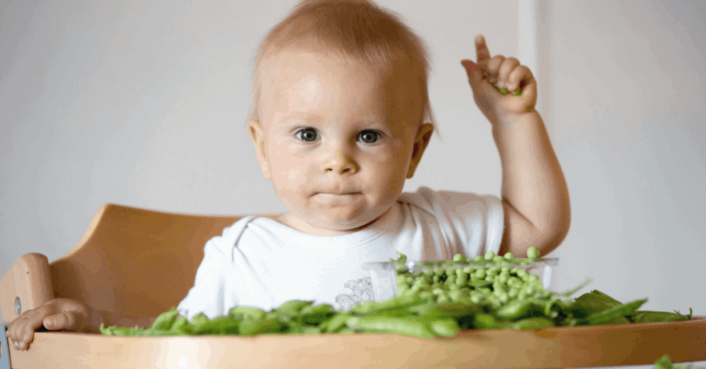 Child eating peas