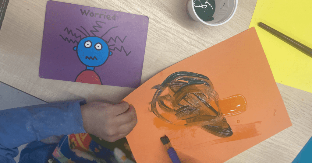 children painting emotions activity