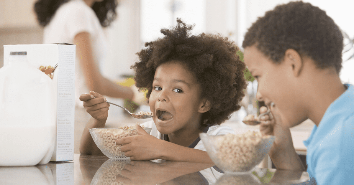 children eating breakfast cereal