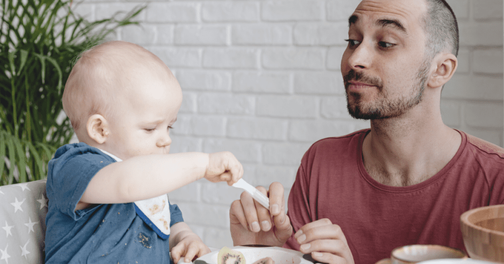 dad and baby eating