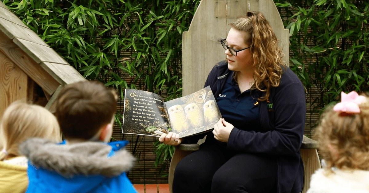 nursery apprentice reading a story to children