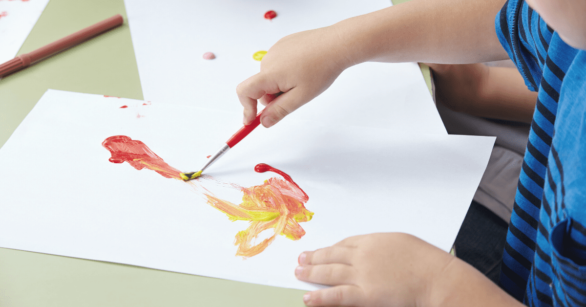 child's hands painting