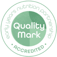 Circular logo for the "early years nutrition partnership quality mark," labeled 'accredited.' the design features white text on a green background with a lighter green circle inside.