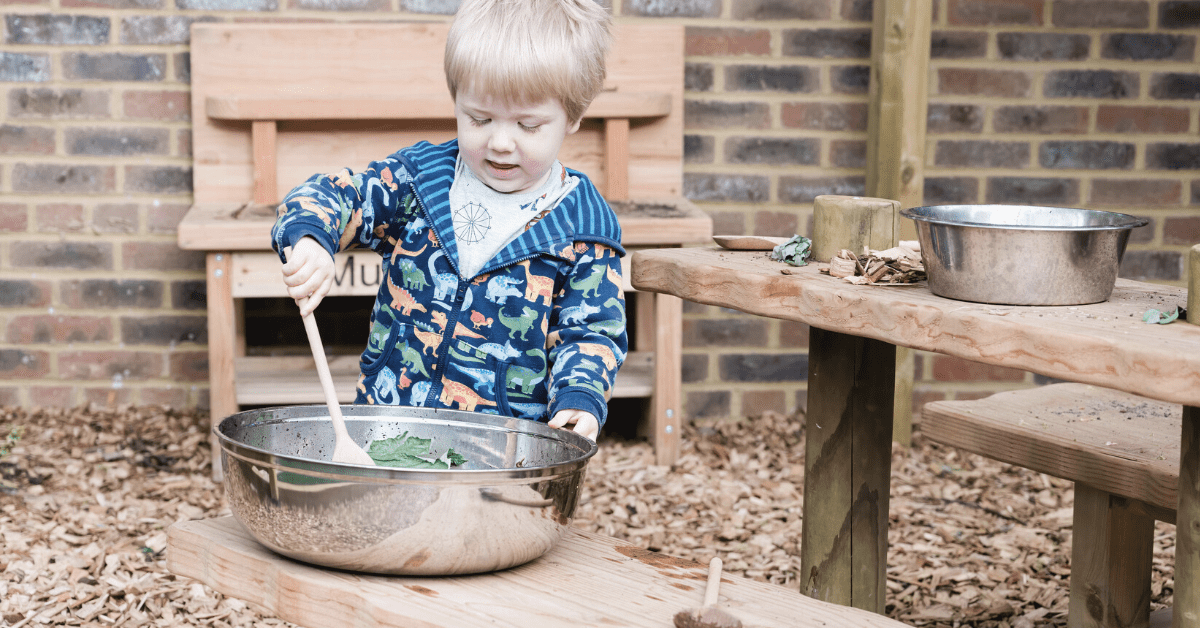 child stirring bowl outside