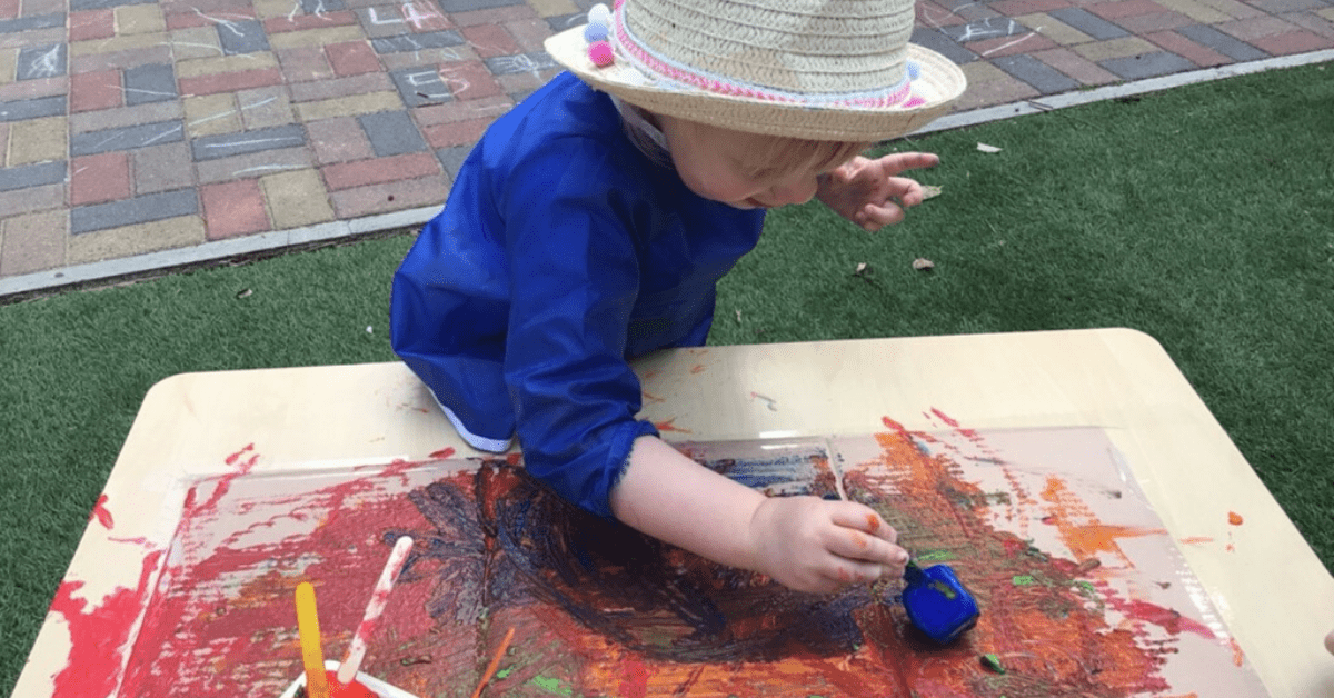 child painting with ice