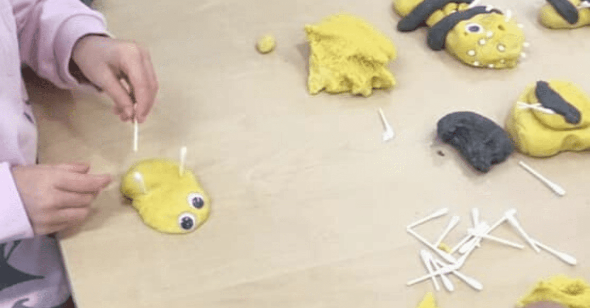children making playdough bugs