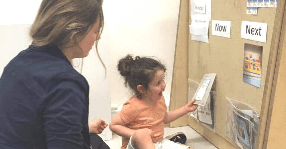 Child interacting with display board