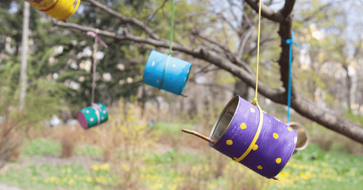 tin can bird feeders hanging from trees