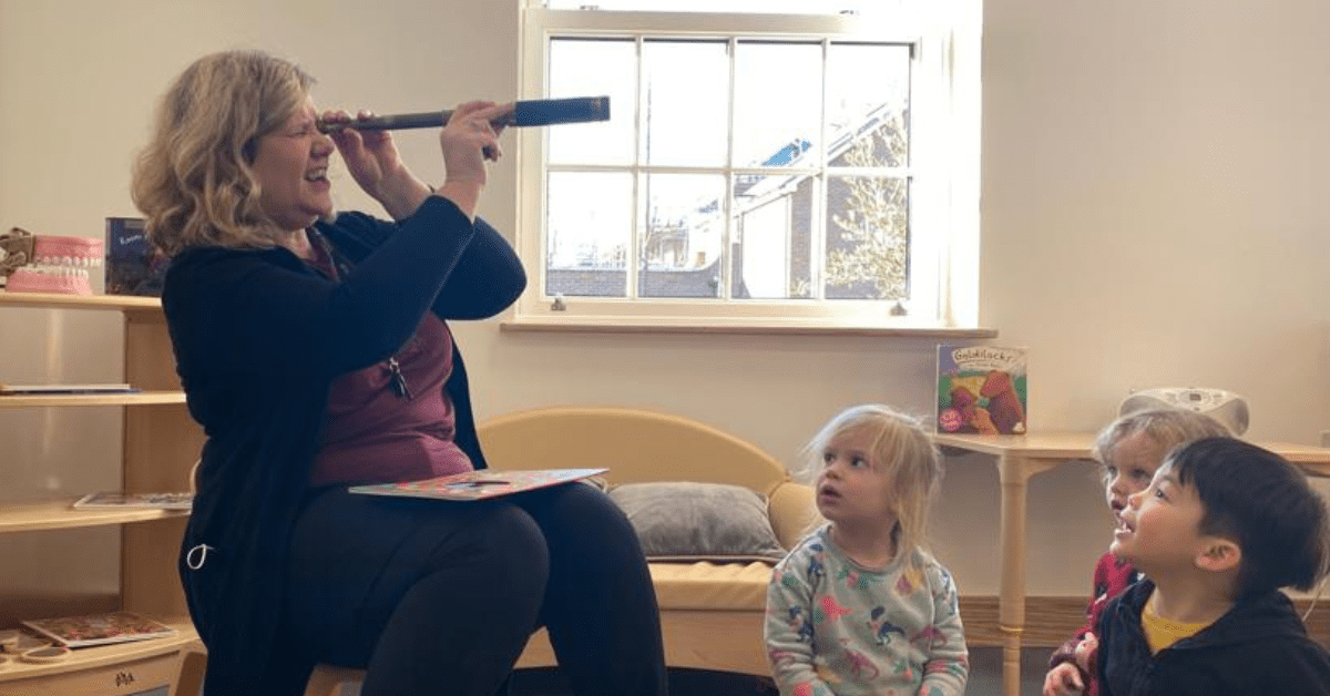 early years teacher role playing story to children