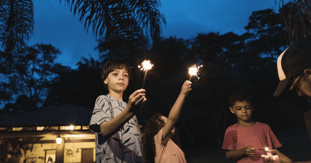 children holding sparklers