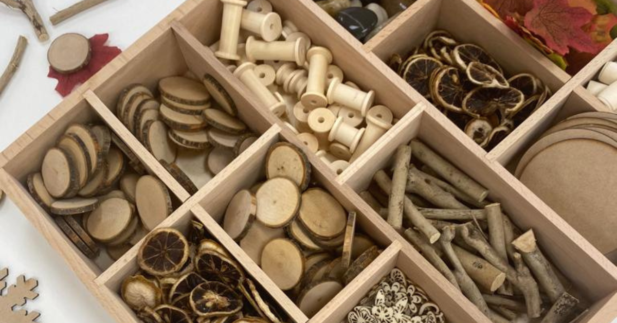 wooden tinker tray of small wooden resources